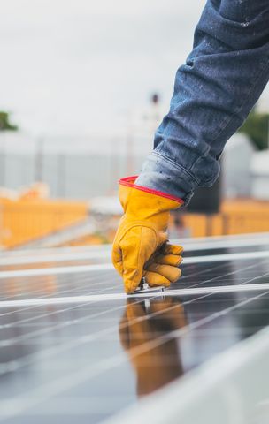 Installers fitting solar panels